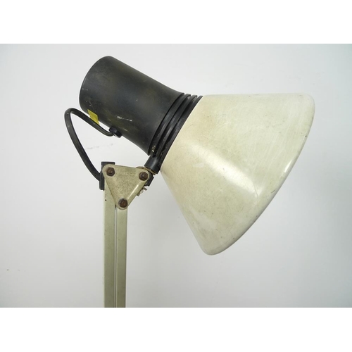 900 - A group of three vintage industrial work-lamps, one circa 1930's with cantilever structure and cast ... 