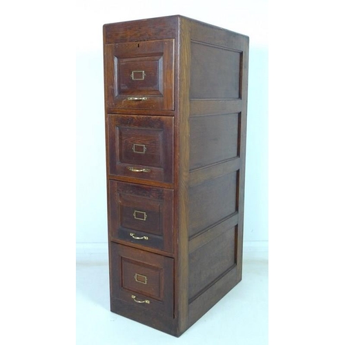 912 - An early 20th century oak five drawer filing cabinet, brass handles, the interiors fitted with remov... 