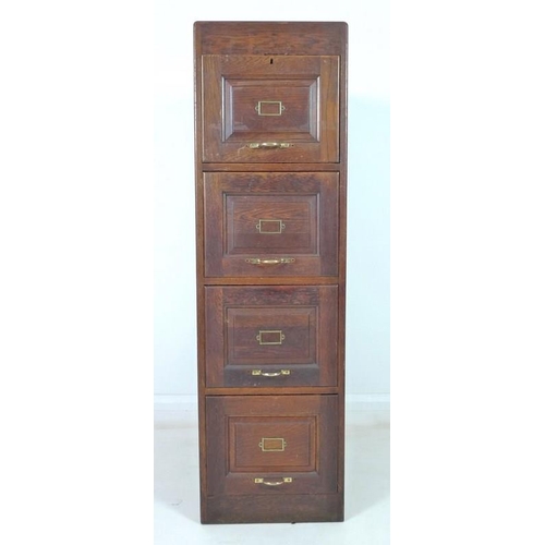 912 - An early 20th century oak five drawer filing cabinet, brass handles, the interiors fitted with remov... 