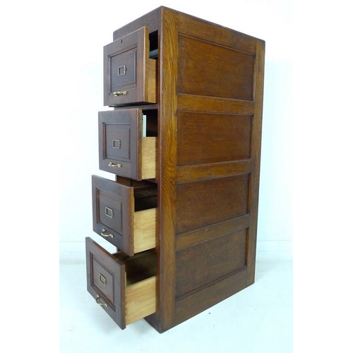 912 - An early 20th century oak five drawer filing cabinet, brass handles, the interiors fitted with remov... 