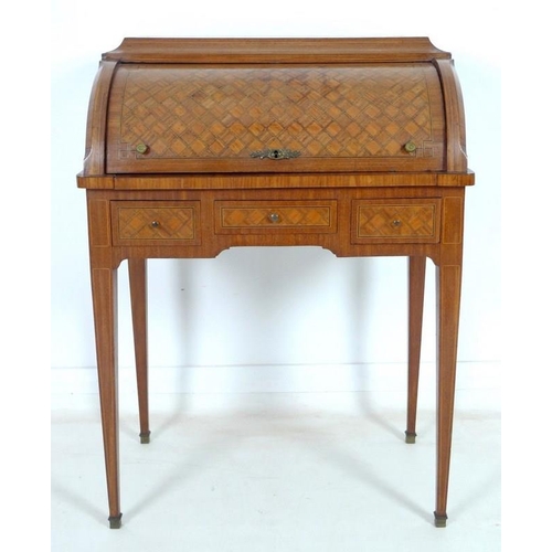 914 - A French early 20th century roll top writing bureau, the body inlaid overall with geometric parquetr... 