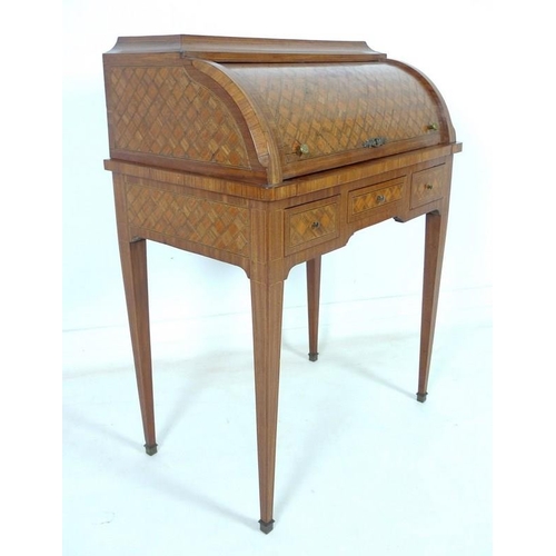 914 - A French early 20th century roll top writing bureau, the body inlaid overall with geometric parquetr... 