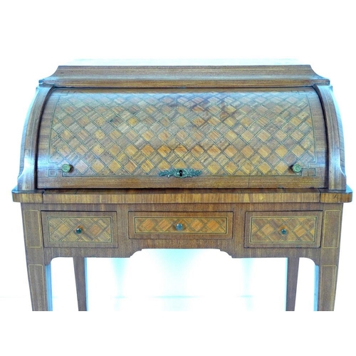 914 - A French early 20th century roll top writing bureau, the body inlaid overall with geometric parquetr... 