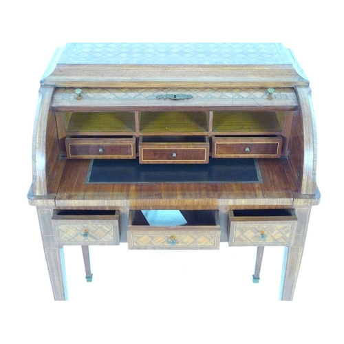 914 - A French early 20th century roll top writing bureau, the body inlaid overall with geometric parquetr... 