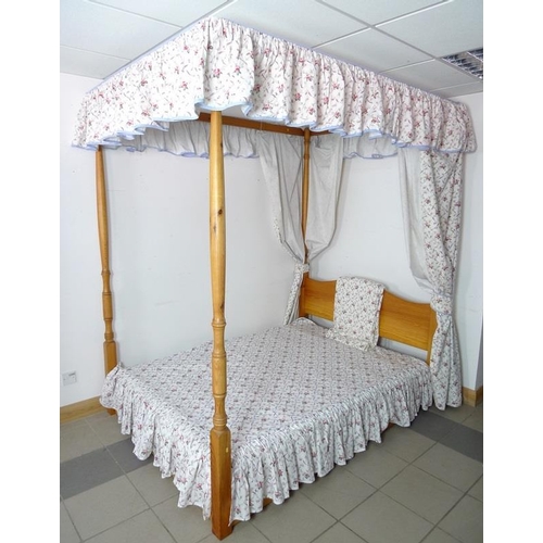 915A - A modern pine four poster double bed, with divan base, and Laura Ashley hangings, of floral pattern ... 