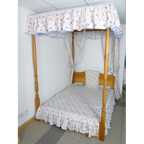 915A - A modern pine four poster double bed, with divan base, and Laura Ashley hangings, of floral pattern ... 