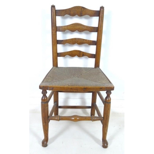 917 - A set of five 19th century oak country ladderback chairs, with rush seats, turned supports joined by... 