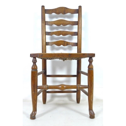 917 - A set of five 19th century oak country ladderback chairs, with rush seats, turned supports joined by... 