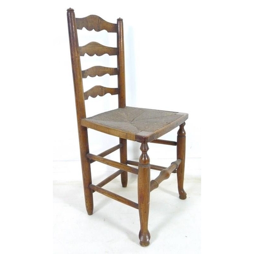 917 - A set of five 19th century oak country ladderback chairs, with rush seats, turned supports joined by... 