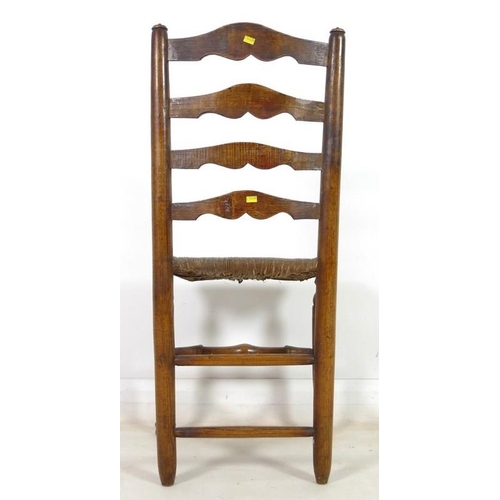 917 - A set of five 19th century oak country ladderback chairs, with rush seats, turned supports joined by... 