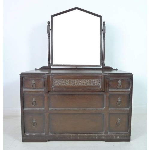 918 - A mahogany dressing chest, mid 20th century, with Gothic style pointed arch mirror on turned support... 