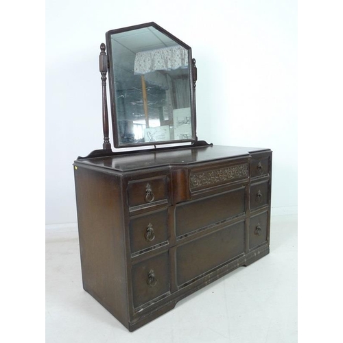 918 - A mahogany dressing chest, mid 20th century, with Gothic style pointed arch mirror on turned support... 