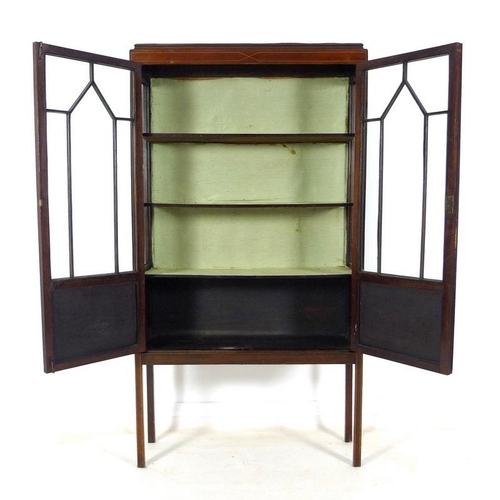 919A - An Edwardian mahogany display cabinet, with two astragal glazed doors and boxwood stringing, raised ... 