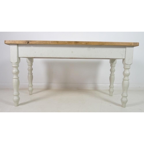 924 - A pine kitchen table, late 20th century, with scrubbed surface, white painted lower section, turned ... 