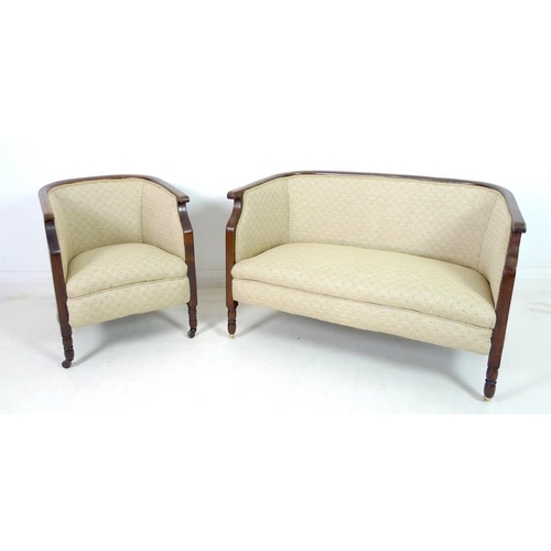 935 - An Edwardian mahogany part salon suite of tub armchair and small settee, upholstered in old gold col... 