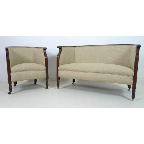 935 - An Edwardian mahogany part salon suite of tub armchair and small settee, upholstered in old gold col... 