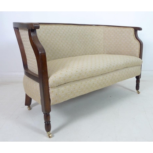 935 - An Edwardian mahogany part salon suite of tub armchair and small settee, upholstered in old gold col... 