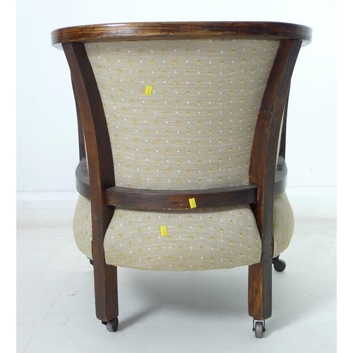 935 - An Edwardian mahogany part salon suite of tub armchair and small settee, upholstered in old gold col... 