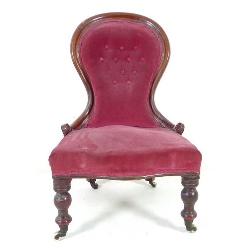 936 - A Victorian mahogany nursing chair, moulded frame, turned front legs and castors, upholstered in but... 