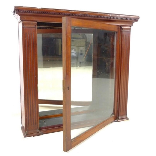 940 - A late Victorian mahogany wall hanging cupboard, with mirrored back and single glazed door, 77 by 21... 