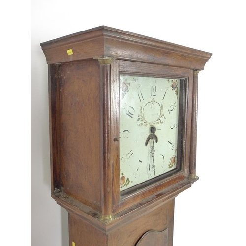 943 - An early 19th century oak long case clock, 30 hour movement striking on a bell, white painted dial, ... 