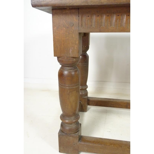 944 - A late 19th century oak refectory table, three plank surface over a chip carved frieze, supported on... 