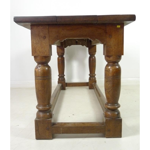 944 - A late 19th century oak refectory table, three plank surface over a chip carved frieze, supported on... 