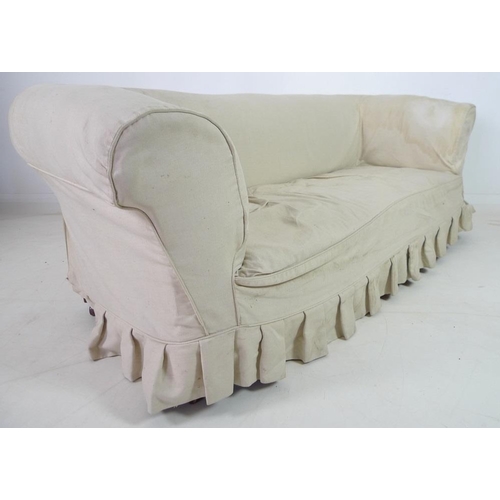 946 - A Victorian beech framed Chesterfield settee, three seater, with turned front legs and brown ceramic... 