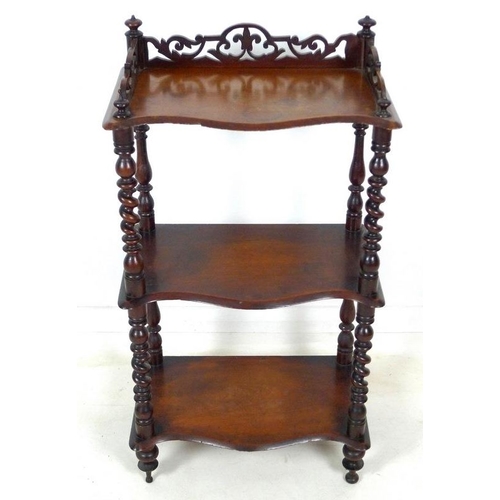 946A - A Victorian mahogany whatnot with pierced fretwork sides to top shelf, barley twist supports, three ... 