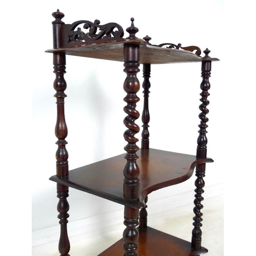 946A - A Victorian mahogany whatnot with pierced fretwork sides to top shelf, barley twist supports, three ... 