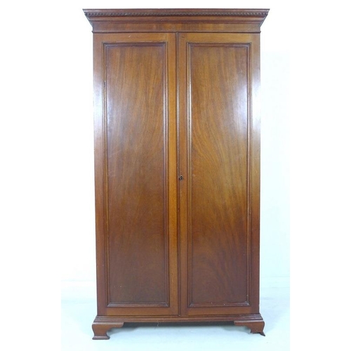 948 - A mid 20th century small mahogany and oak two door wardrobe, dentil moulded cornice, ogee bracket fe... 