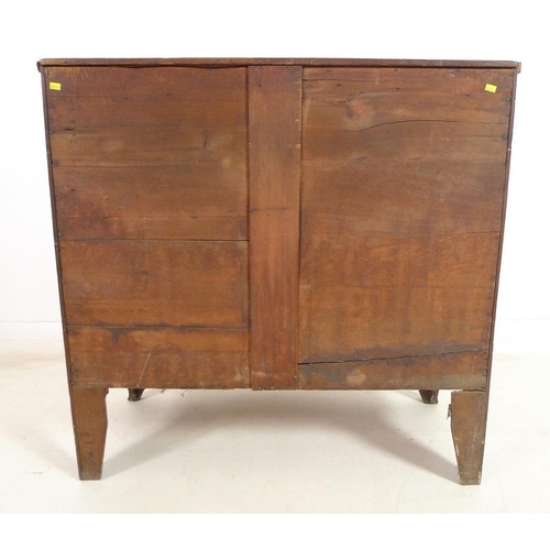 949 - A Regency mahogany bow fronted chest of two short over two long drawers, with turned handles and coc... 