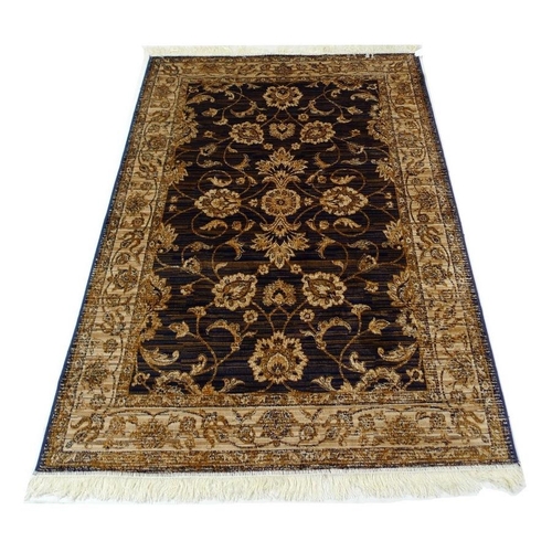 952 - A Ziegler rug, with dark blue ground and beige floral decoration, 190 by 140cm.