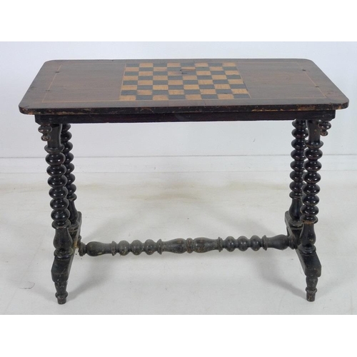 953 - A Victorian games table mahogany, fruitwood and ebonised, with chess board to the surface, on a bobb... 