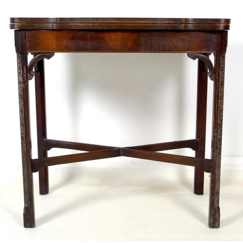 954 - A 19th century mahogany carved table, shaped fold over surface over a plain frieze, raised on chamfe... 