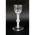 An 18th century opaque air-twist stem and knop drinking glass with soft fluted bucket bowl, English,... 
