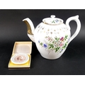 A Russian teapot by Kuznetsov, the porcelain body painted with floral sprigs and gilding, 20cm high,... 