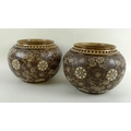 A pair of Doulton Lambeth jardinieres, circa 1920, of ovoid form with pierced rims, decorated in dar... 