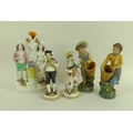 A group of 19th century ceramic figurines, comprising a Staffordshire figural stem vase, of flower s... 