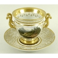A Flight, Barr & Barr porcelain cup and saucer, circa 1810, of twin handled urn form, decorated agai... 
