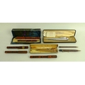 A collection of writing instruments, including a Ronson 'Penciliter', combining a pencil with a ligh... 