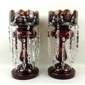 A pair of Bohemian ruby glass lustres, enamelled with floral sprays and hand gilded, circa 1890, eac... 