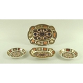 A group of four Royal Crown Derby dishes, two of graduated quatrefoil form the other two circular, d... 