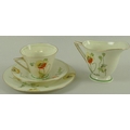 A Royal Doulton Poppy pattern six person tea set, comprising cups, saucers, small plates, 18cm, cake... 