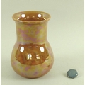 A Ruskin orange lustre vase, stamped to base, 11 by 15.5cm, together with a single hexagonal blue ce... 