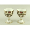 A pair of Royal Crown Derby stemmed goblets in the Imari pattern, number 1128, 12cm. (2)