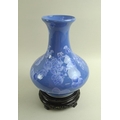 A 20th century Chinese porcelain vase of squat baluster form, with flared rim, the lavender blue gla... 