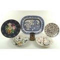 A selection of mostly English 19th century ceramics including a floral painted charger with navy blu... 