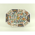 A Chinese porcelain octagonal platter, the body painted with flowering foliage in blue, read, yellow... 