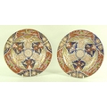 A pair of Royal Crown Derby plates decorated in the Imari colour way, circa 1830.